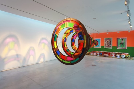 5. (front) Zak Ové, Time Tunnel, 2010, Perspex and plywood (back) Hassan Hajjaj, Le Salon, 2010, mixed media installation, installation view at Chaos into Clarity- Re-Possessing a Funktioning Utopia, image courtesy of Sharjah Art Foundation